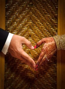 Couple Using Their Hands to Create a Heart Pose